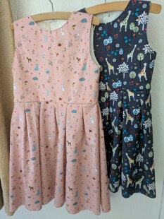 Two little girl's dresses