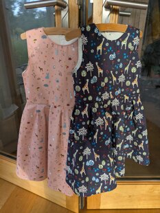 Two little girl's dresses