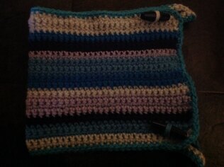 Crocheted coffee cosy