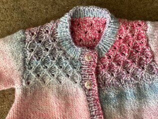 Smocked baby cardigan