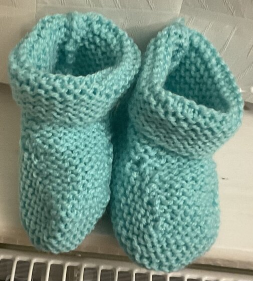 Knitted baby bootees