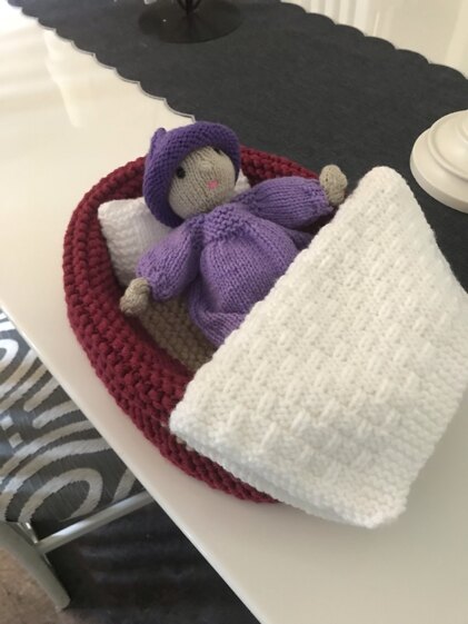Baby doll and carry cot